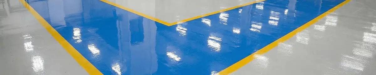 A factory floor professionally covered and marked with epoxy flooring in Mobile, AL