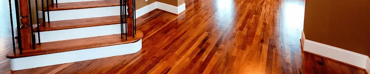 Base floor of a staircase with professionally restored wood flooring in Mobile AL