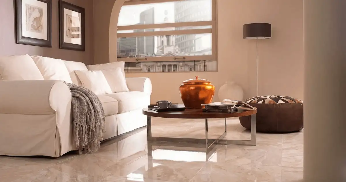 Modern living room with professionally installed marble flooring, a beige sofa, coffee table in Mobile, AL