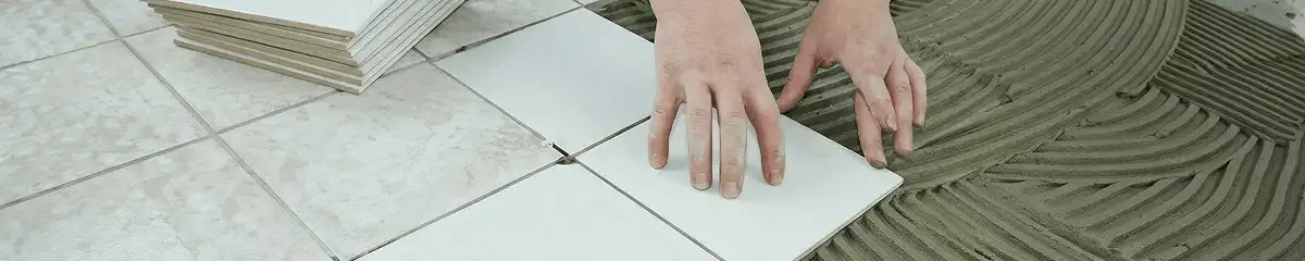 Professional installing white tile floors in Mobile, AL