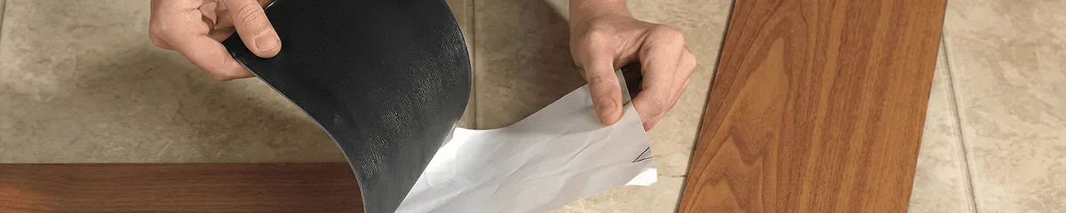 A professional installing vinyl flooring in Mobile, AL
