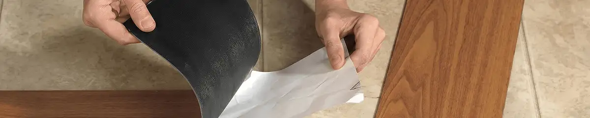 A professional installing vinyl flooring in Mobile, AL