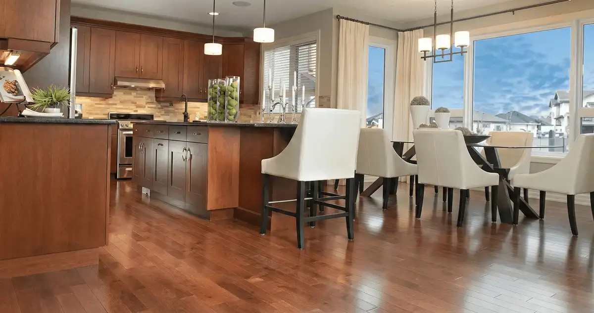 A modern kitchen with professionally installed wood flooring in Mobile, AL